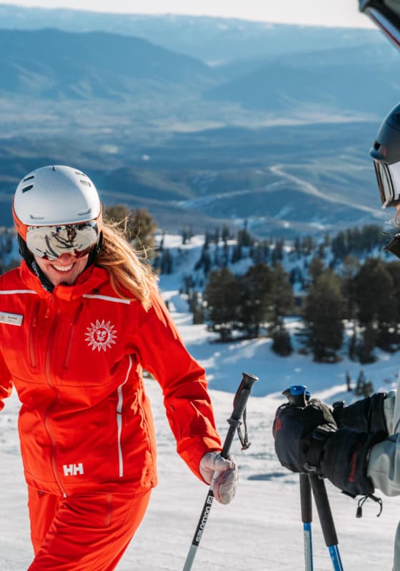 A thrilling winter sports scene at Snowbasin, Utah featuring a skier gliding down snowy slopes amidst a scenic view of a popular ski resort. Potential onlookers include a snowboarder and a family enjoying their ski time.