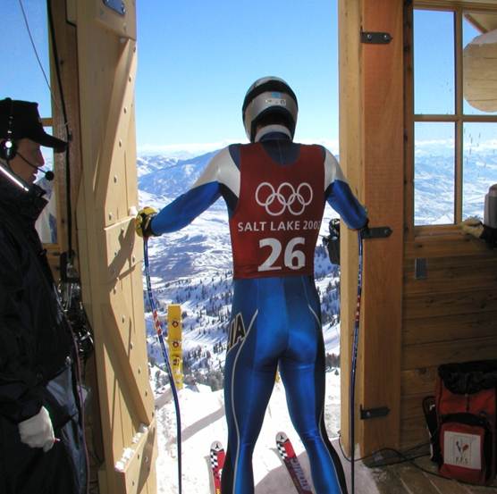 A skier navigating the snowy slopes at Snowbasin a popular winter sports centre and ski resort in Utah USA. The atmosphere is lively hinting at other winter sports enthusiasts on site.