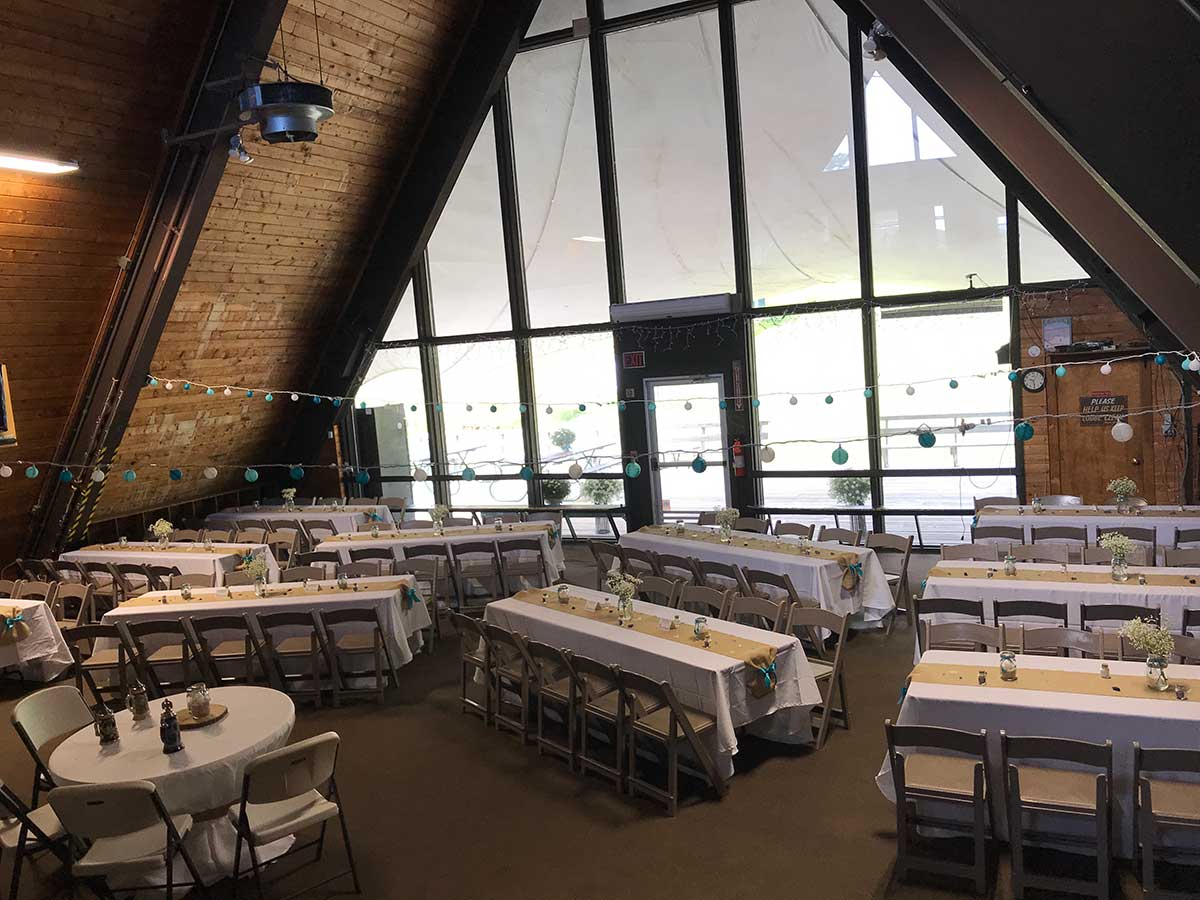 Camden Snow Bowl in USA - a large room with tables and chairs in it.