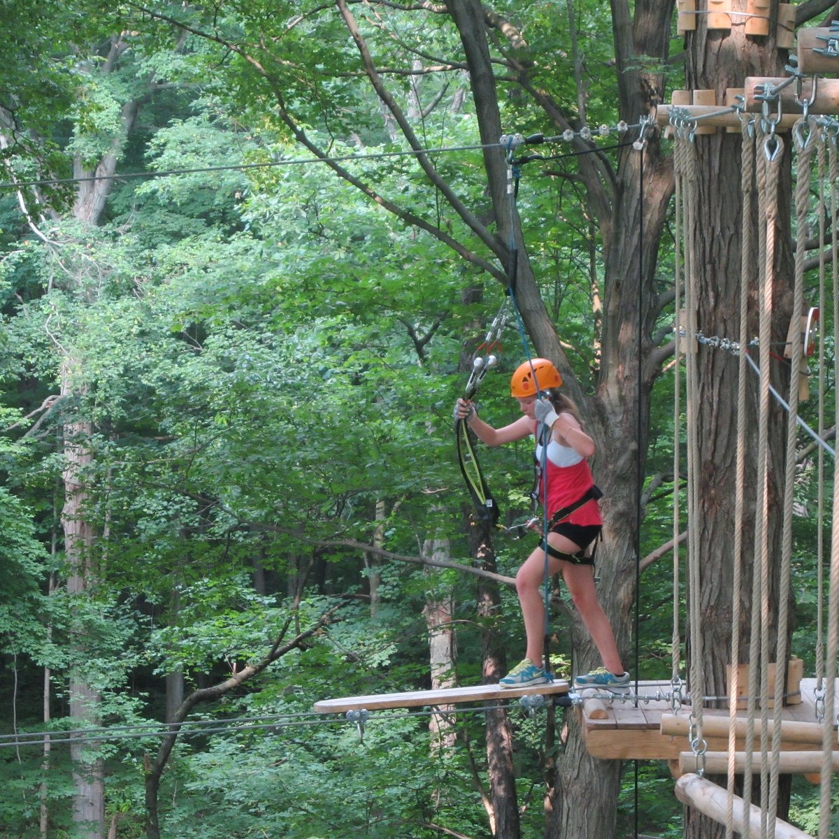 Boler Mountain in Canada - a woman on a zip line in the forest.