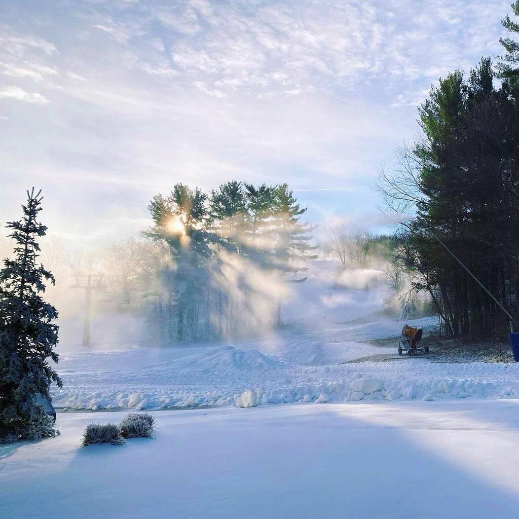 Boler Mountain in Canada - a man standing in the snow with a snow blower.