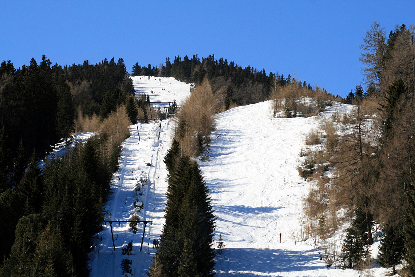 Rieseralm in Austria - a ski lift going up a snowy slope.