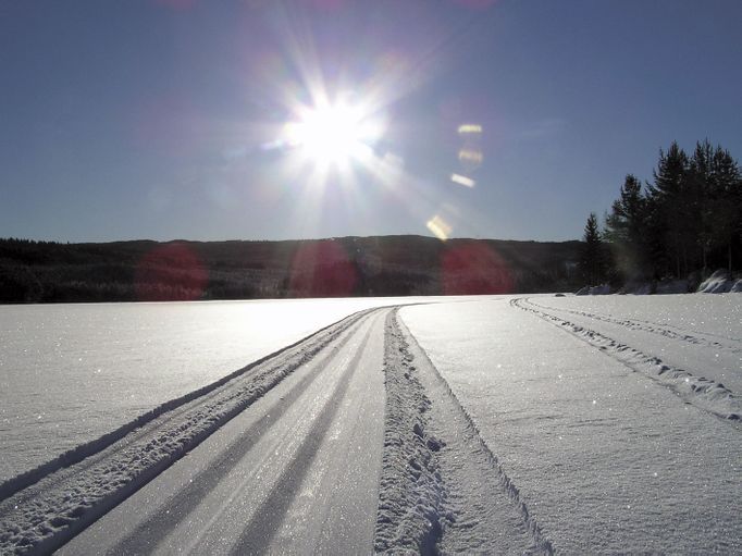 Storlien in Sweden - the sun is shining over the snow covered field.