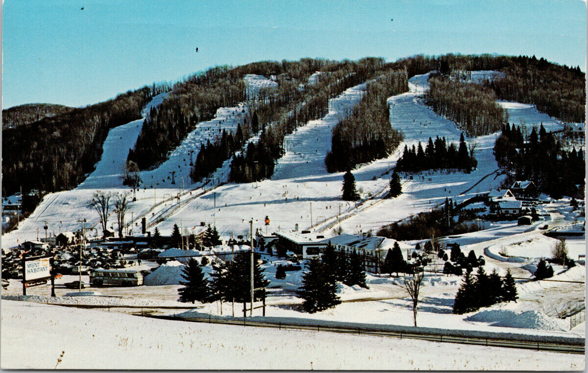 Mont Habitant in Canada - a view of a ski area with a mountain in the background.