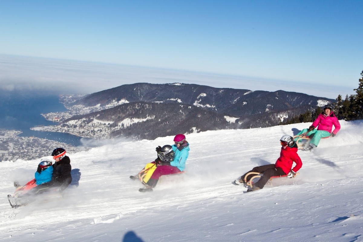 Wallberg in Germany - a group of people riding down a snowy slope.
