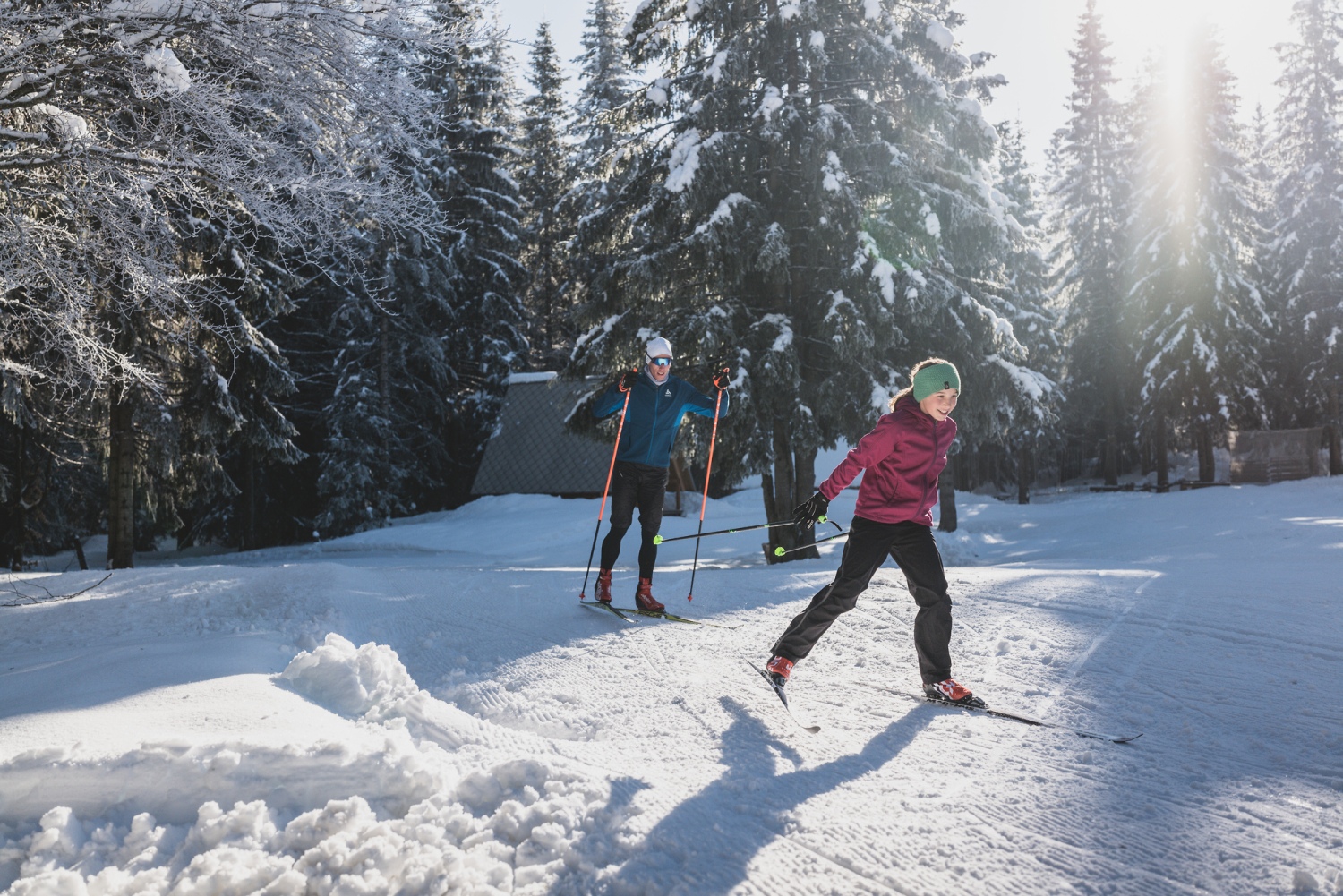 Soriška Planina in Slovenia - two people cross country skiing in the snow.