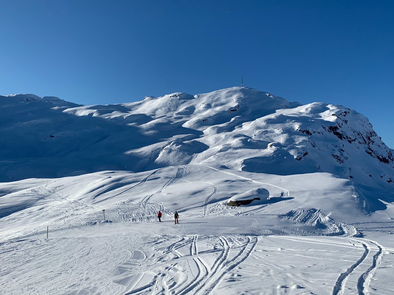Sauda Skisenter in Norway - a person standing on top of a snowy mountain.