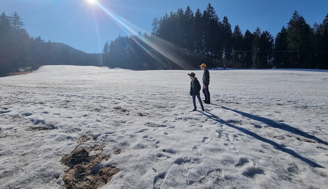 Thrilling winter sports scene at Ski Park Racibor Oravský Podzámok Žilina Slovakia featuring stunning winter scenery a charming chalet on a bright sunny day.