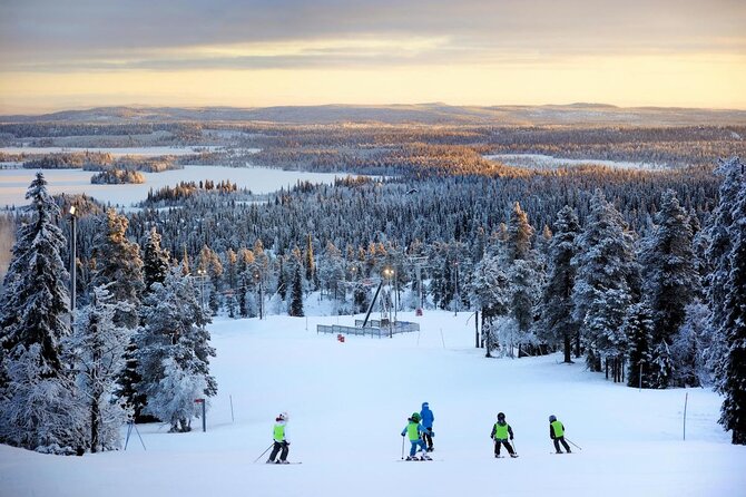 Winter sports enthusiasts partake in skiing at the Suomutunturi resort in Lapland, Northern Finland, surrounded by stunning winter scenery and a ski lift.