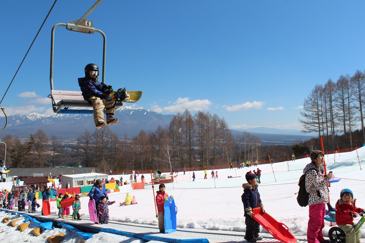 Saku Ski Garden Parada in Japan - a person on a ski lift in the air.