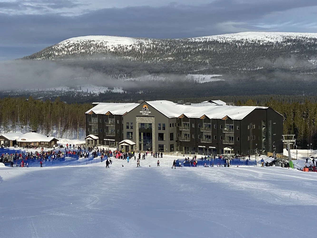Stöten in Sweden - a group of people skiing down a snow covered slope.