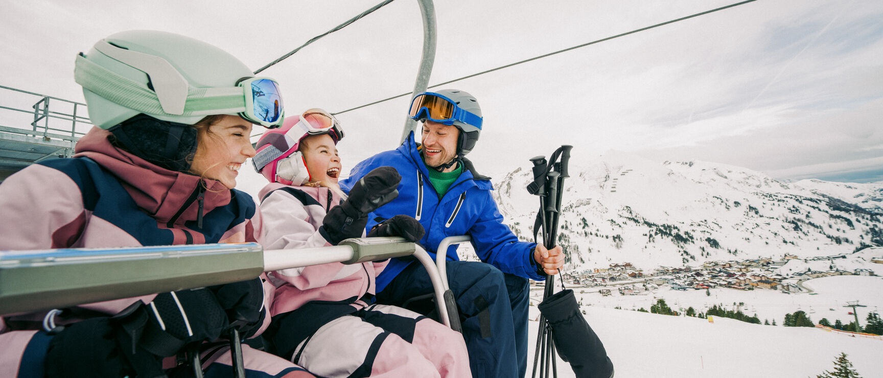Niederalpl in Austria - two women on a ski lift in the mountains.