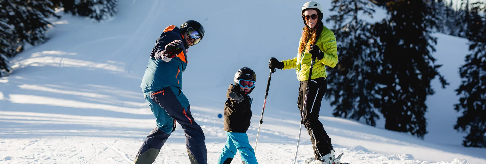 Niederalpl in Austria - a group of people skiing down a snowy hill.