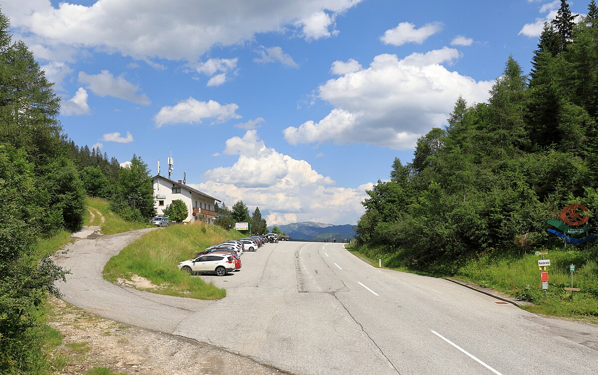 Niederalpl in Austria - a road with a car parked on the side.