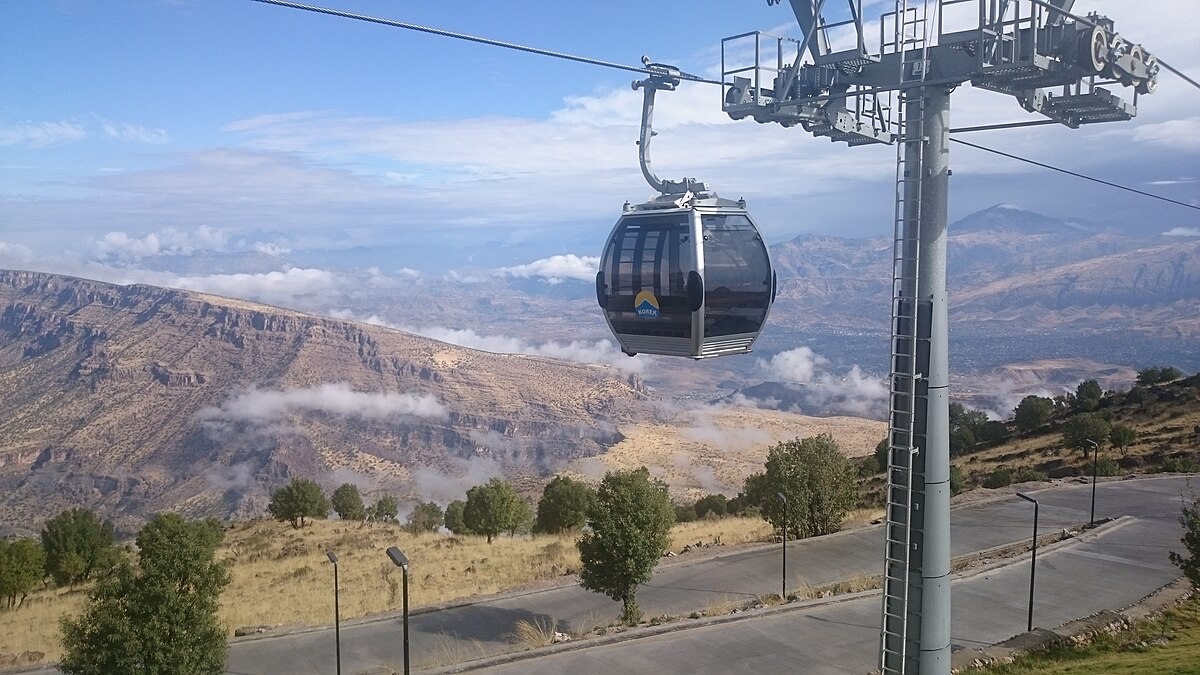 Korek Mountain Resort in Iraq - a cable car on the side of a road.