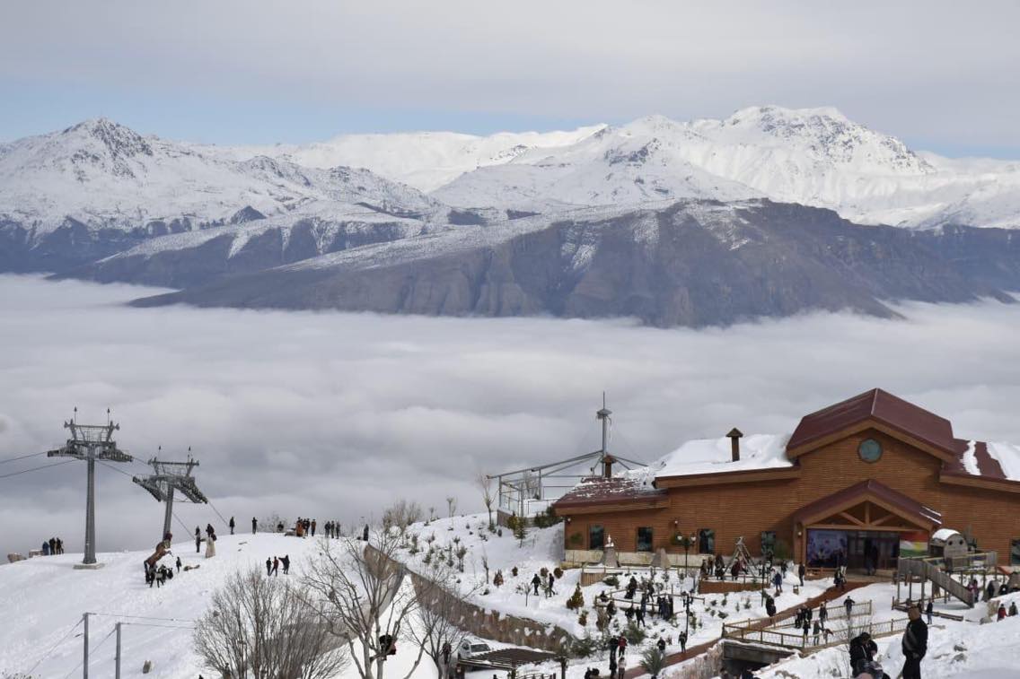 Korek Mountain Resort in Iraq - a church in the snow with mountains in the background.