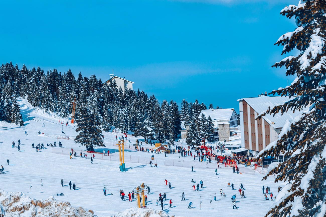Yıldıztepe in Turkey - a group of people skiing down a snowy slope.