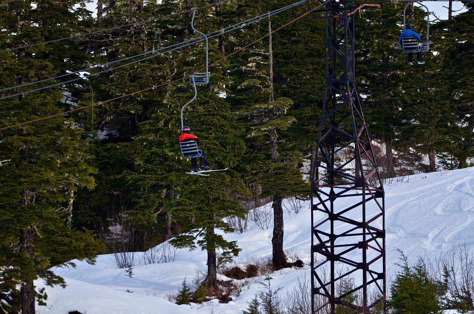 Mt Eyak Ski Area in USA - a ski lift going up a snowy slope.