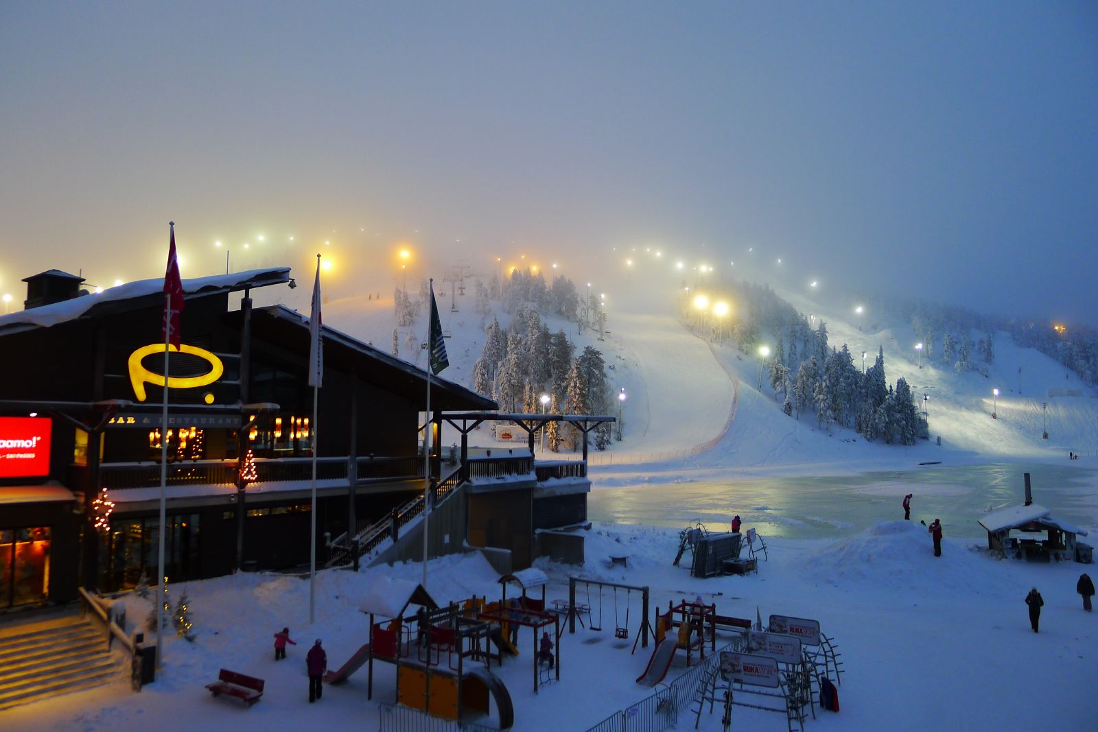 Ruka in Finland: a ski resort in the snow at night.