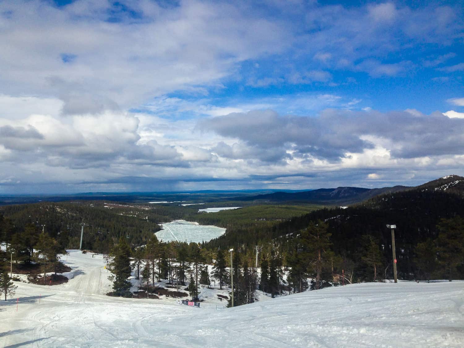 Ruka in Finland - a person on a snowboard on a snowy slope.