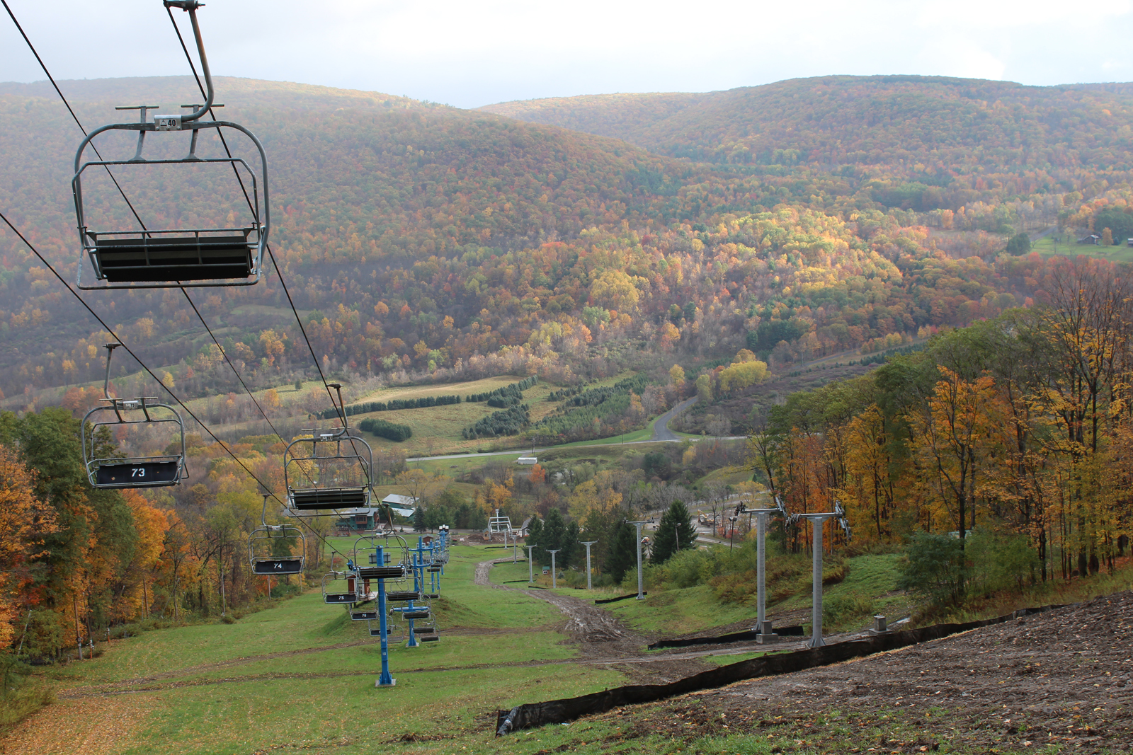 Hunt Hollow Ski Club in USA - a ski lift going up a hill in the fall.