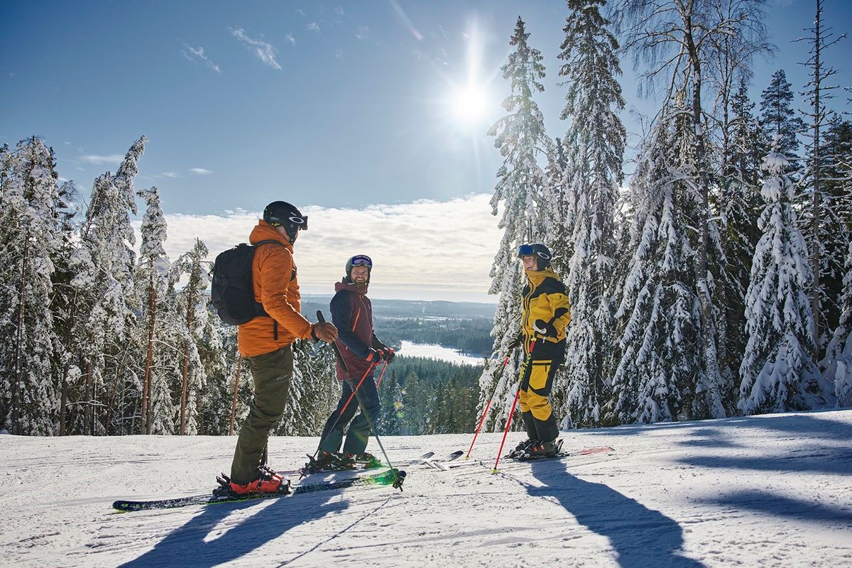 Isaberg Mountain Resort in Sweden - two people are skiing down a snowy hill.