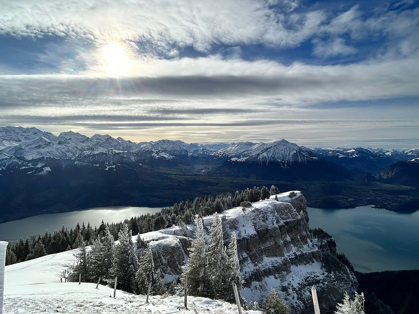 Winter sports enthusiasts enjoying the snowy slopes at the Beatenberg-Niederhorn ski resort, amidst the stunning winter scenery of the majestic Bernese Overland in Switzerland.