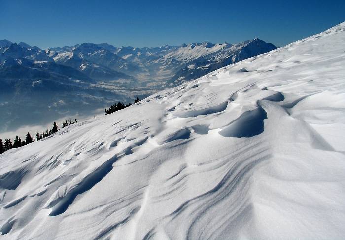 Beatenberg-Niederhorn in Switzerland - a person on a snowboard in the mountains.
