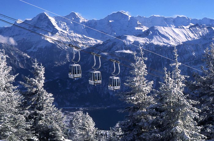 Beatenberg-Niederhorn in Switzerland - a ski lift going up a snowy mountain.