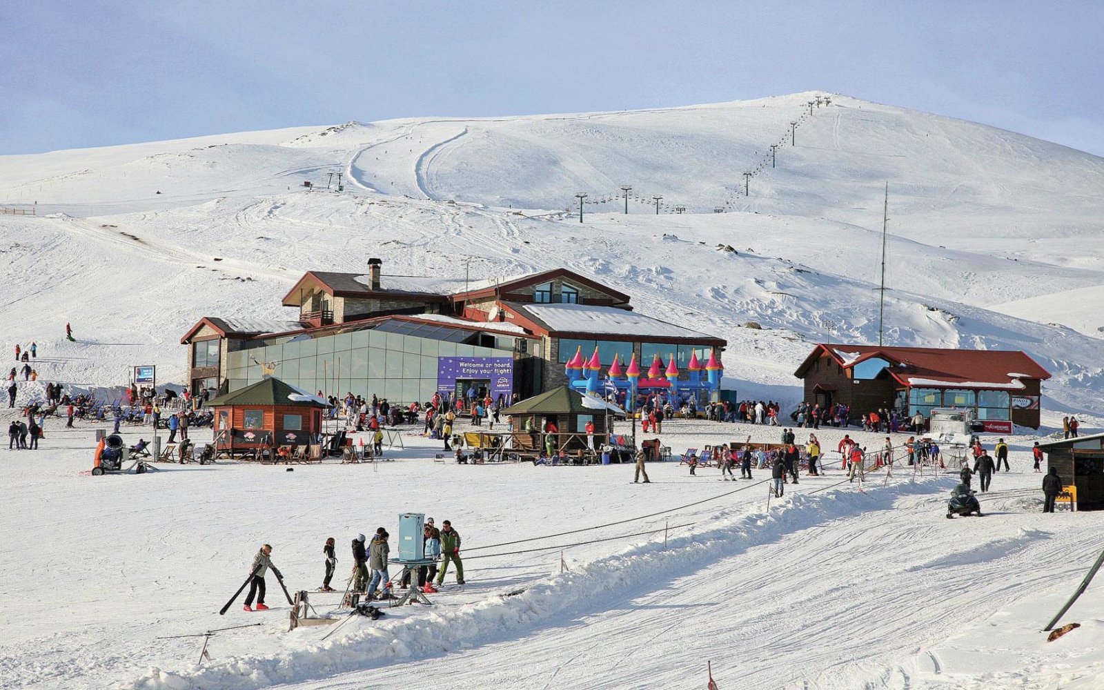Voras – Kaimaktsalan in Greece - a group of people skiing down a snowy hill.
