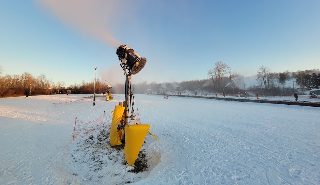 Winter sports scene at Mad River Mountain Zanesfield Ohio with pristine snowy landscapes and a snowmobile offering stunning winter scenery and adventure activities.