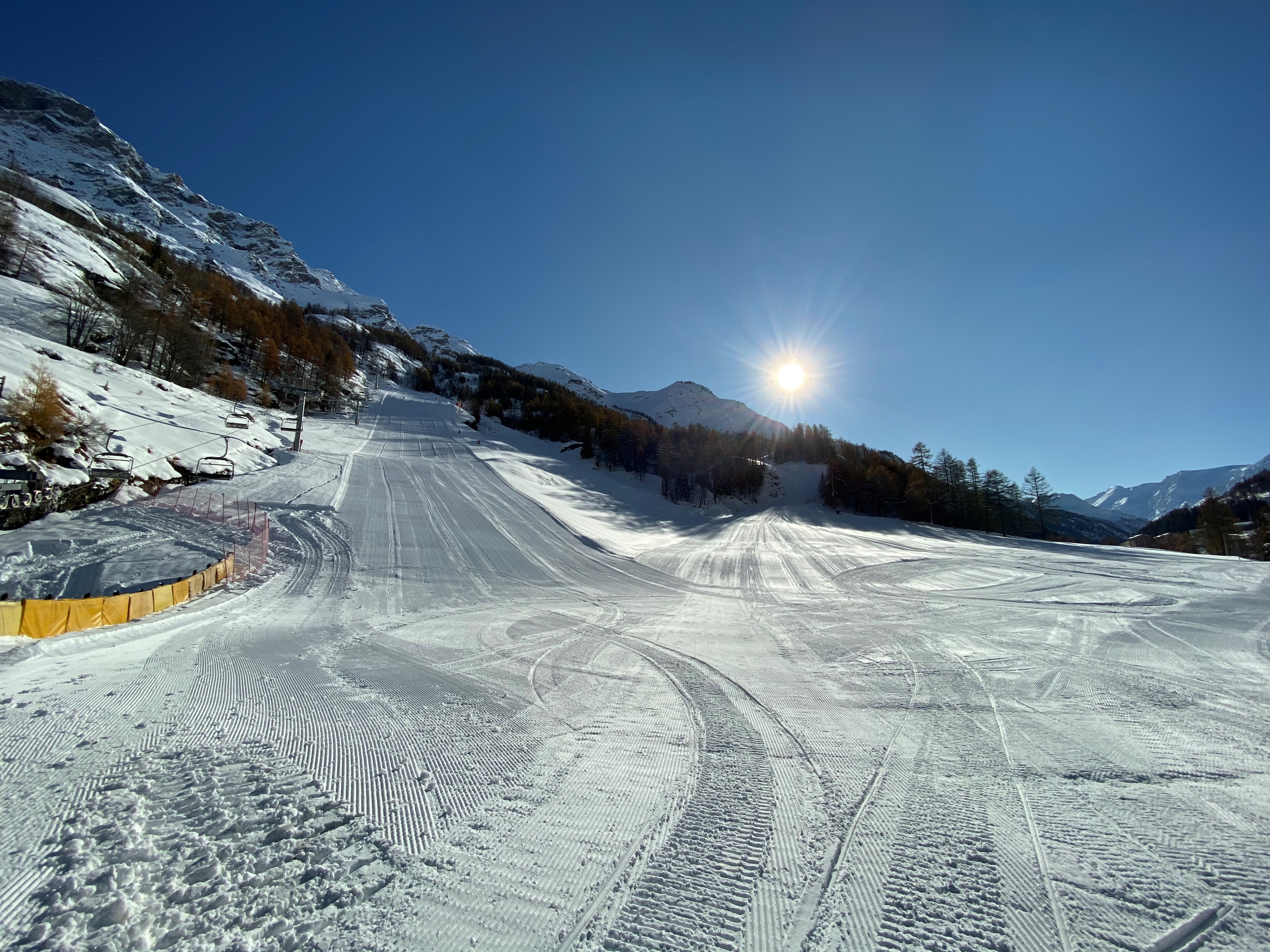 Winter sports scene at Valgrisenche in Gran Paradiso, Italy. Active snow-filled ski resort featuring a quaint chalet, amid the splendor of winter scenery.