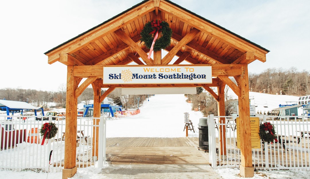 Ski resort at Mt Southington in Connecticut, USA featuring winter sports scenes visible on the snow-covered mountain, epitomizing breathtaking winter scenery.