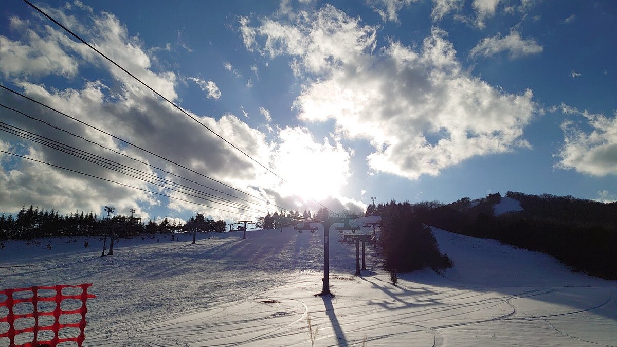 Osa in Japan - the sun is shining through the clouds in the sky.