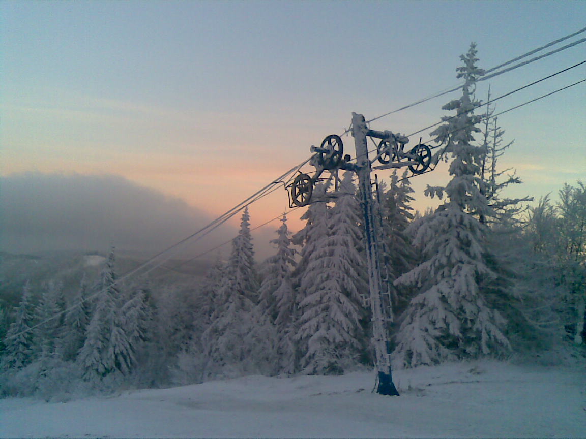 Skipark Erika in Slovakia - a ski lift going up a snowy hill.
