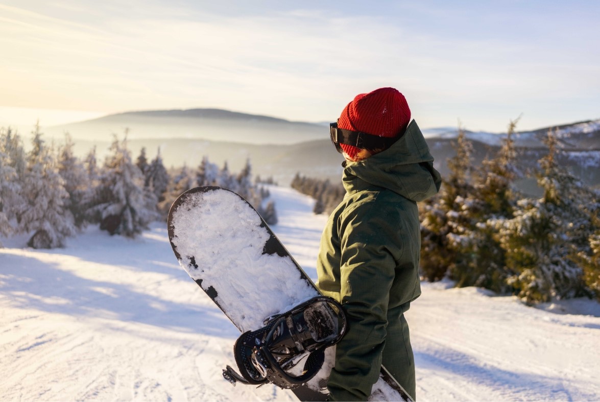 Predigtstuhl Arena in Germany - a person holding a snowboard in the snow.
