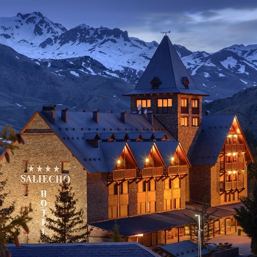 Formigal in Spain: the hotel at night with mountains in the background.