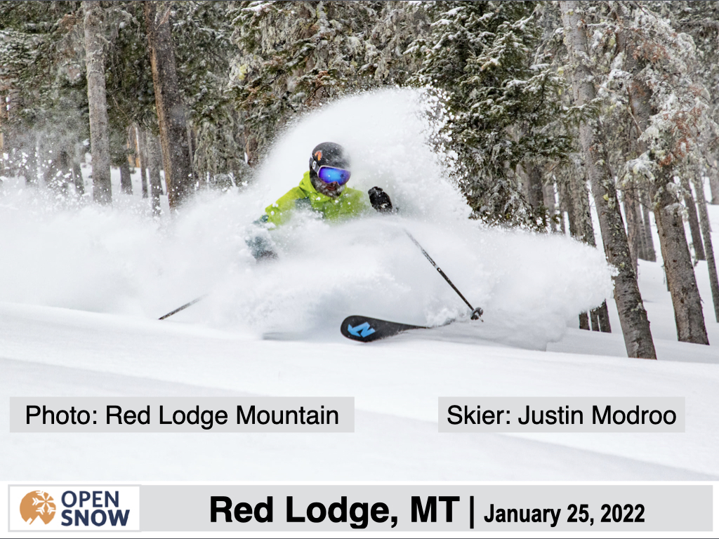 Crystal Mountain - MI in USA - a person is skiing down a snowy hill.