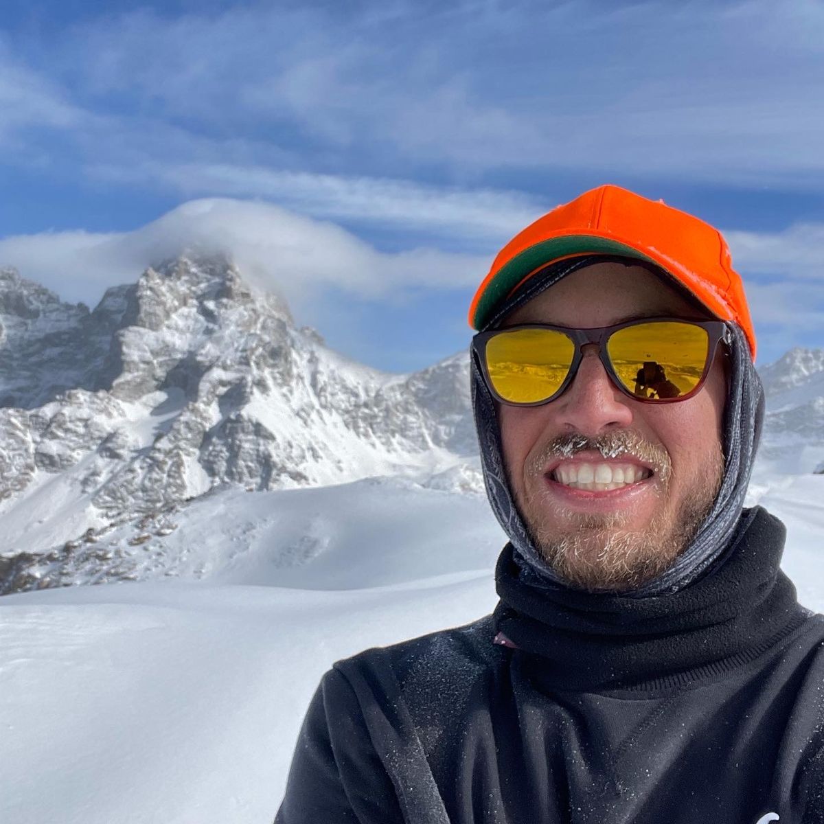Table Mountain in Canada - a man wearing a hat and sunglasses standing in the snow.