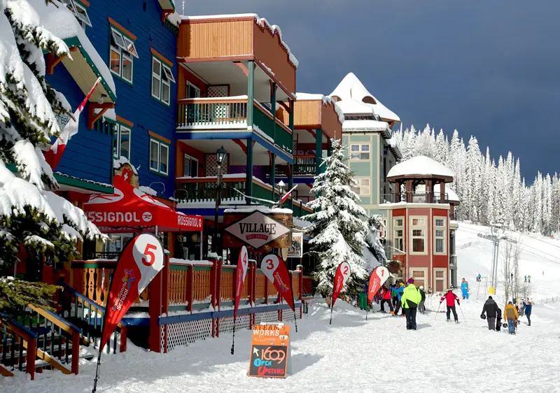 Scenic view of Silver Star Ski Resort in Thompson Okanagan, British Columbia, Canada, covered in a blanket of snow. Visible are the ski lifts against a backdrop of idyllic winter scenery.