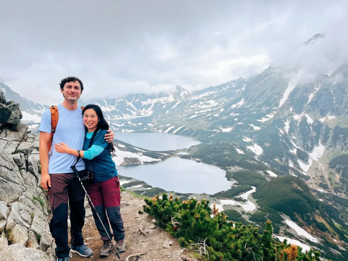 Palenica in Poland - a man and woman standing on top of a mountain.