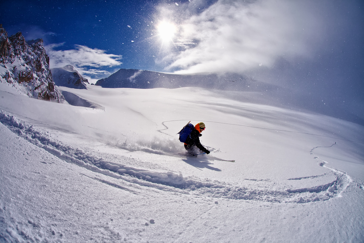 Okutone Snow Park in Japan - a person skiing down a snow covered mountain.