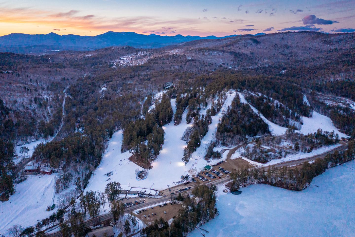 King Pine in USA: an aerial view of a ski resort at sunset.