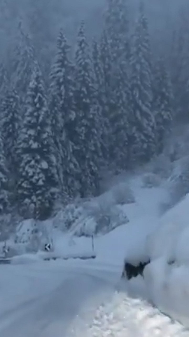 Pian Benot Sciovie Usseglio in Italy - a car is driving down a snowy road.