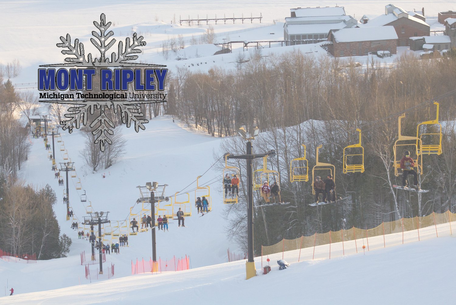 Mont Ripley in USA - a group of people skiing down a snowy hill.