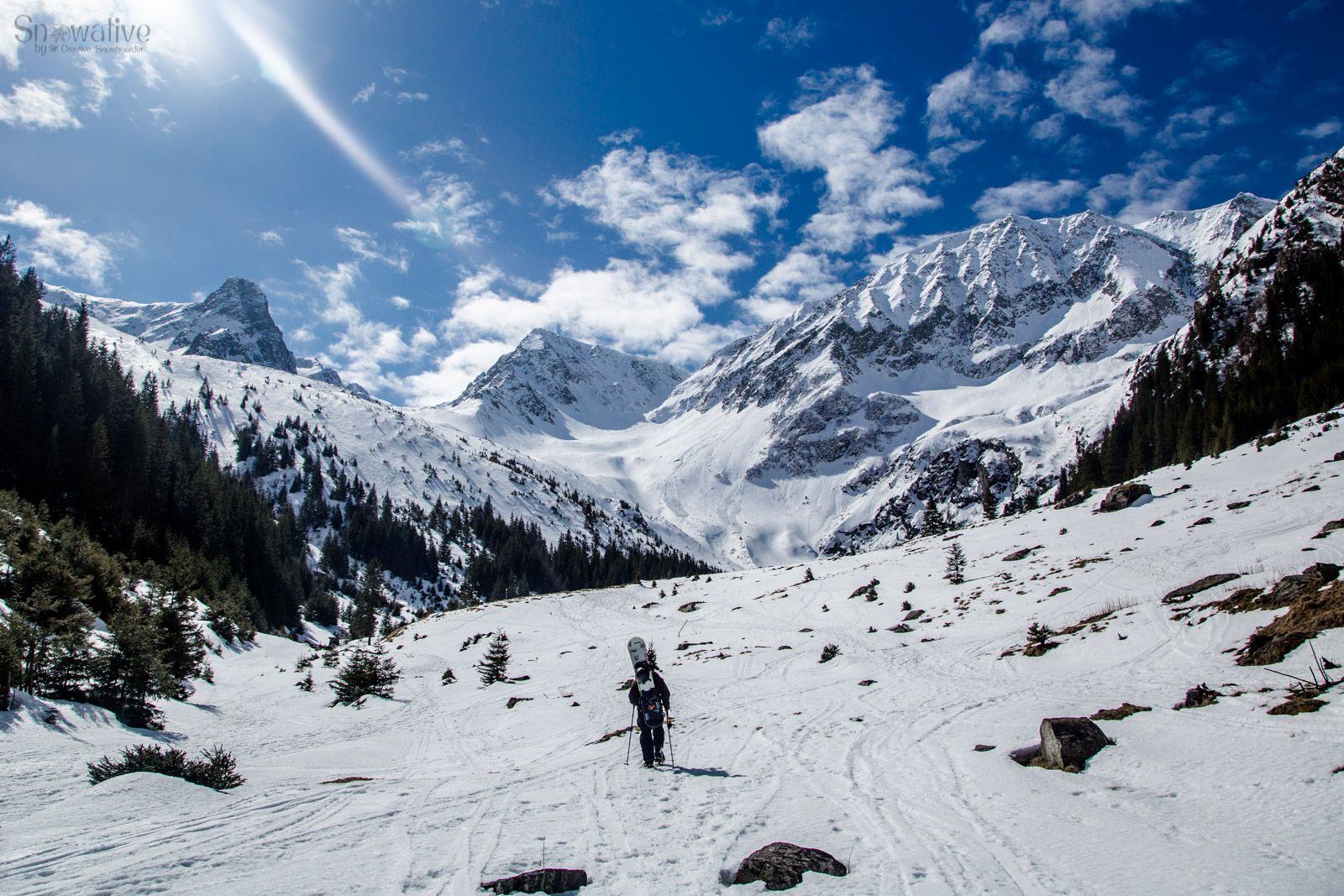 Pârtia de Schi Luna Șes in Romania - a person skiing down a snow covered mountain.