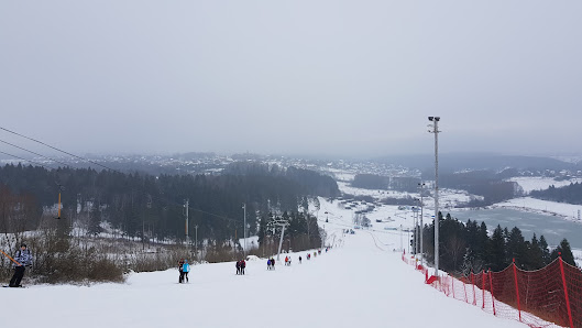 Winter scene at Sorochany in Kurovo, Moscow, Russia featuring a bustling ski resort. Snow-laden slopes and winter sports enthusiasts enjoying the scenic landscape.