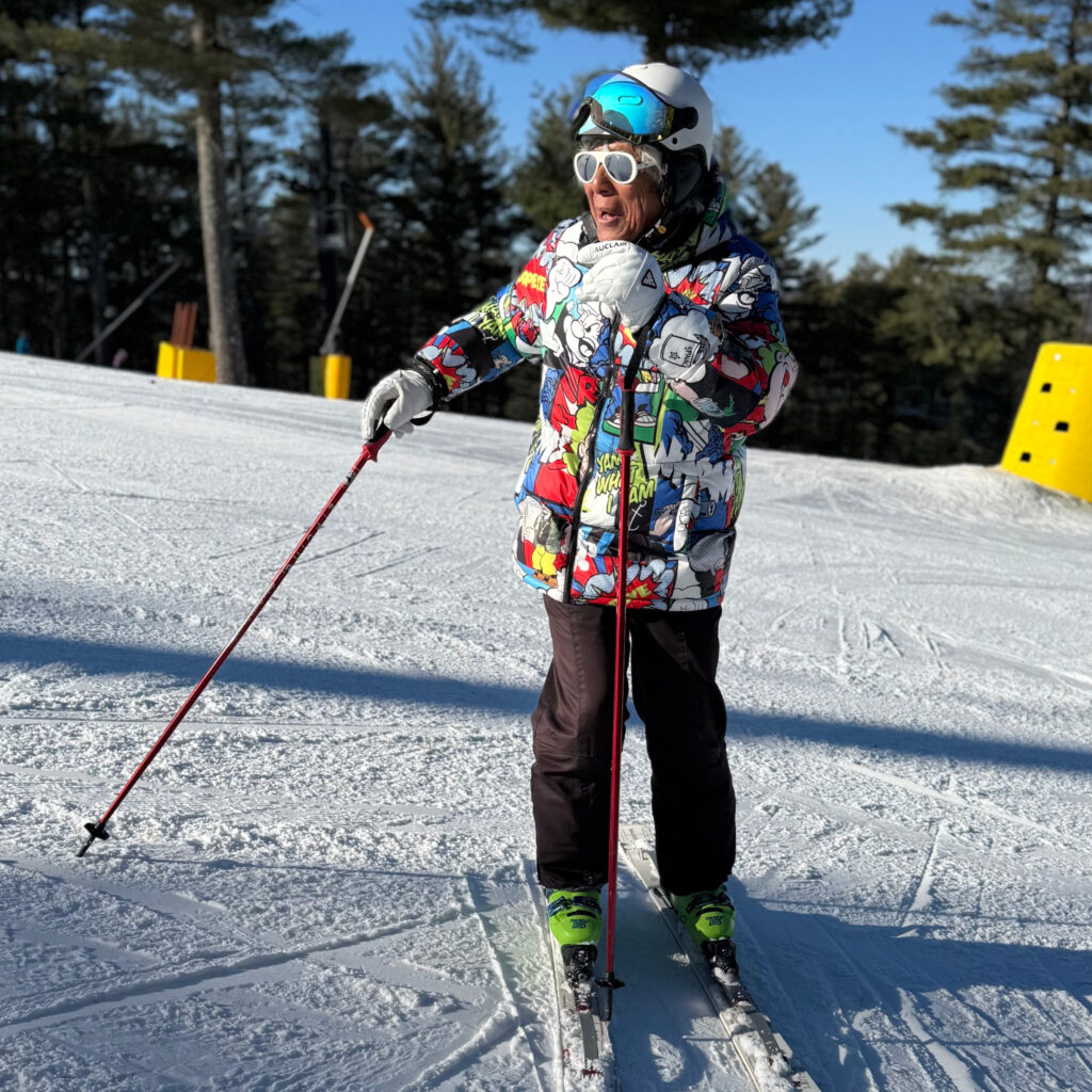 Nashoba Valley Ski Area in USA - a young boy is skiing down a snowy hill.