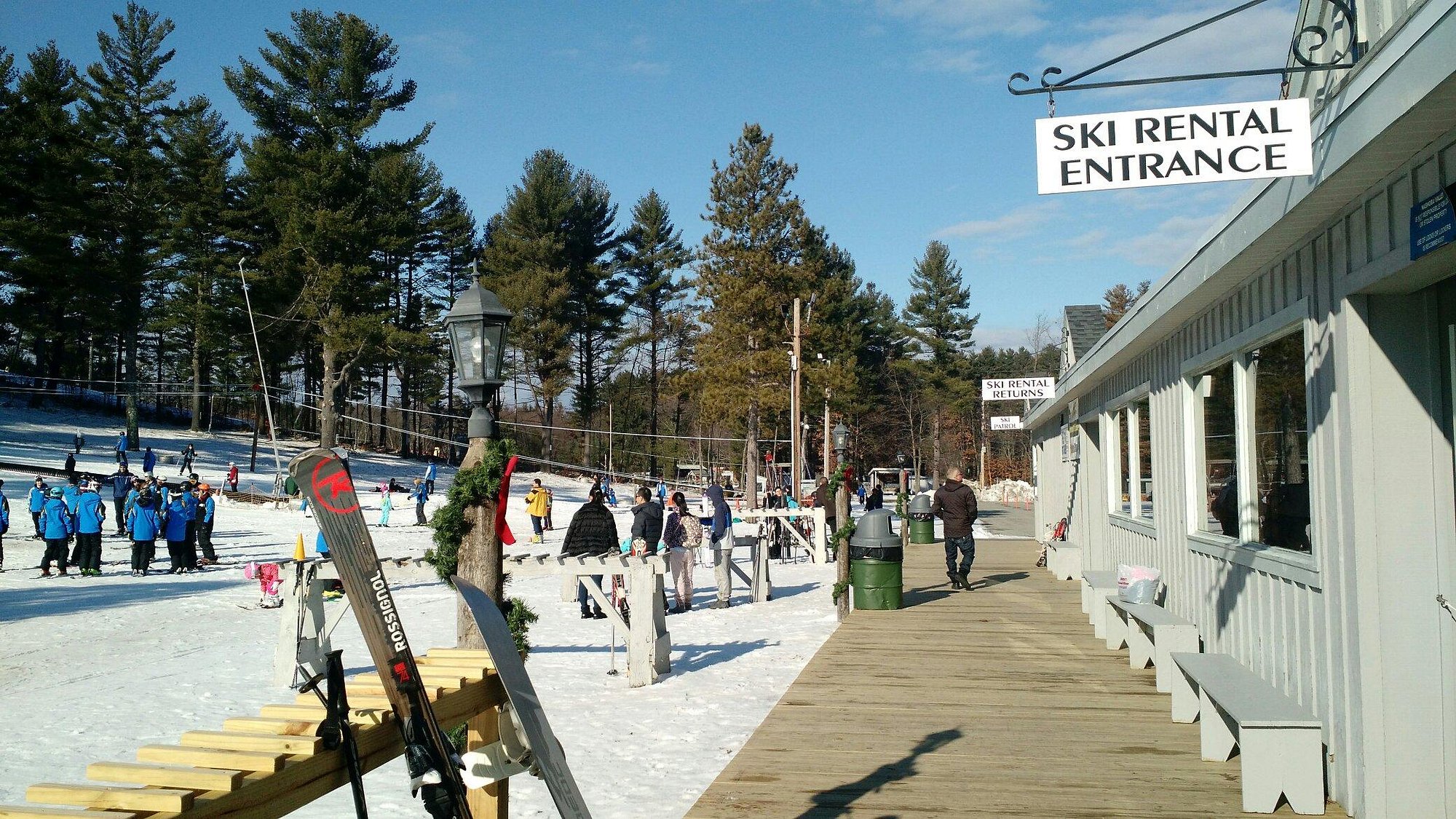 Winter scene at Nashoba Valley Ski Area in Westford, Massachusetts, showcasing a bustling ski resort filled with enthusiasts enjoying snow sports amidst a breathtaking winter landscape.