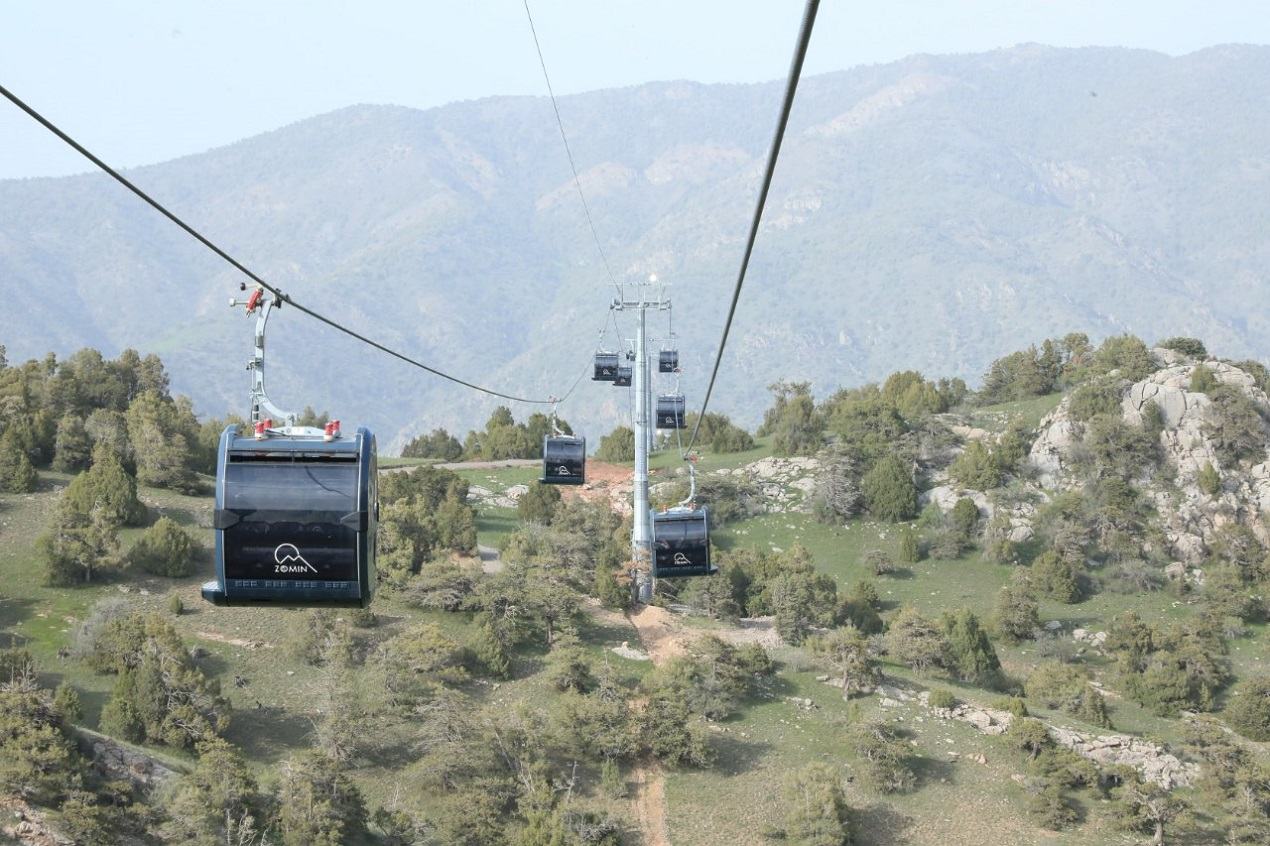 Zomin Ropeway in Uzbekistan - a cable car going up a mountain side.